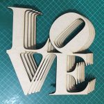 CNC cut MDF letters that say LOVE by The Altered State