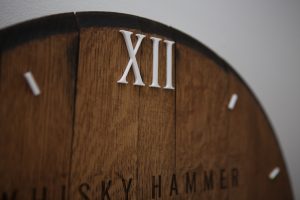 Engraved cask end clock with acrylic numerals for Whisky Hammer. Engraved by The Altered State with Faitmaiz