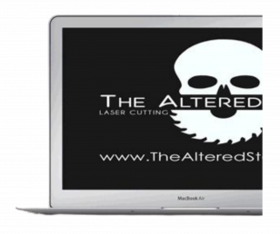 The Altered State - Half laptop with skull saw